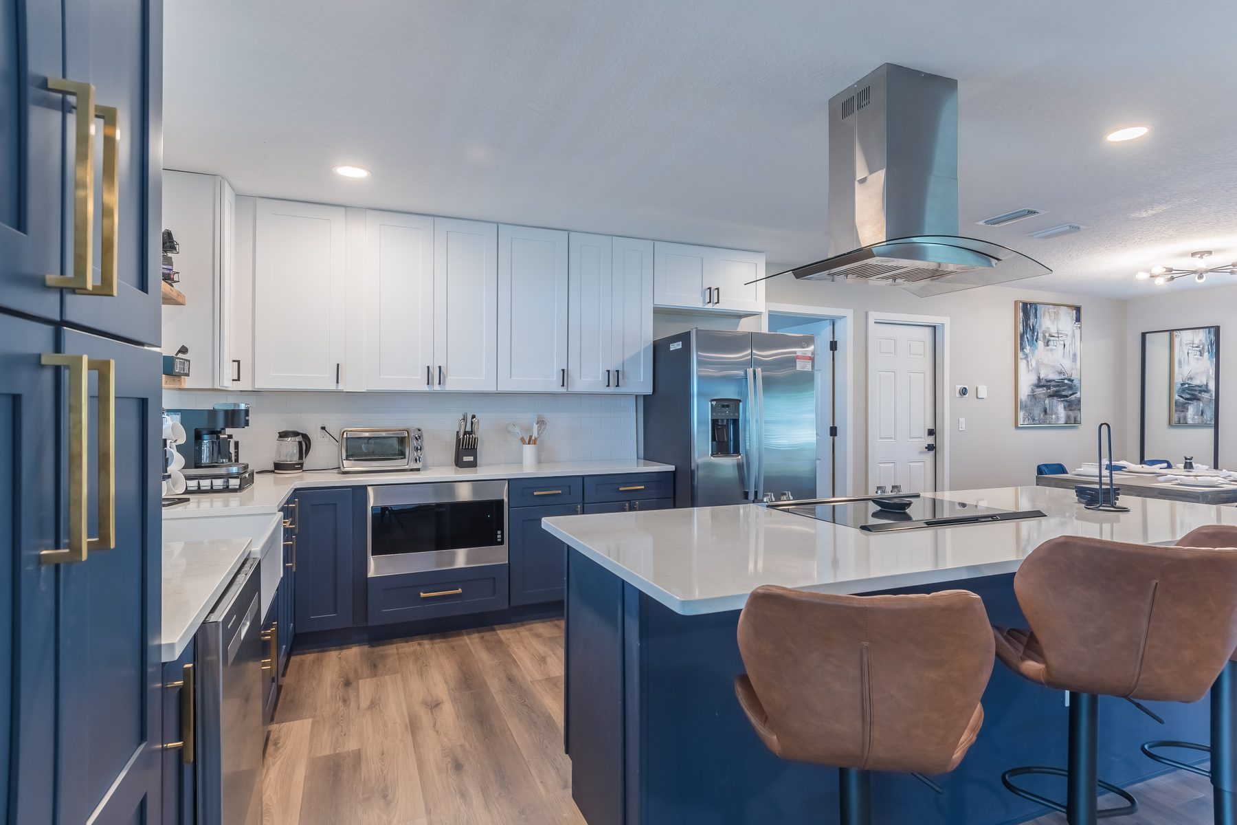 Custom navy and white kitchen with waterfall island