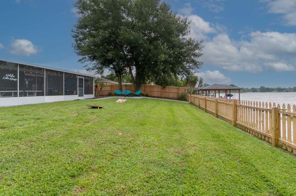 Backyard with screened porch and dock
