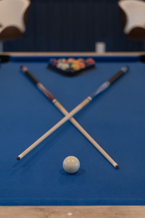 Pool table detail with crossed cues